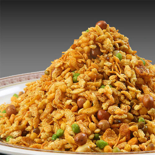 Crispy Indian savoury snacks in bowls